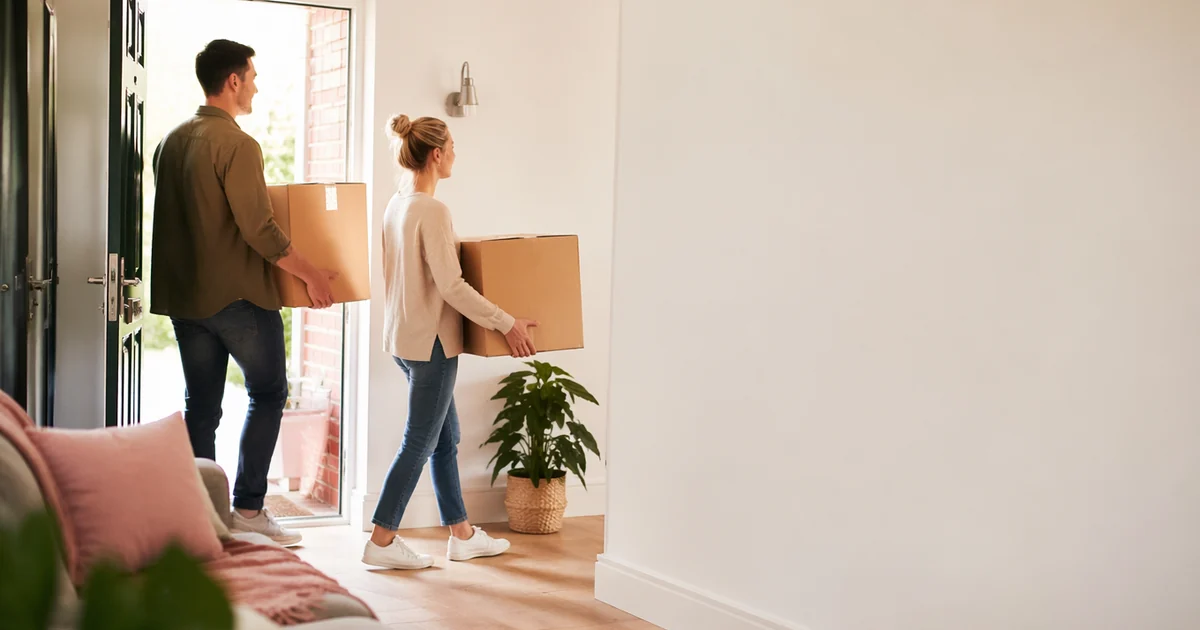 Moving home with broadband in the UK: boxes and router ready for a move day.
