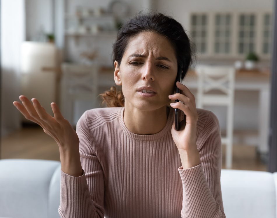 Frustrated customer raising a complaint about her broadband service by phone